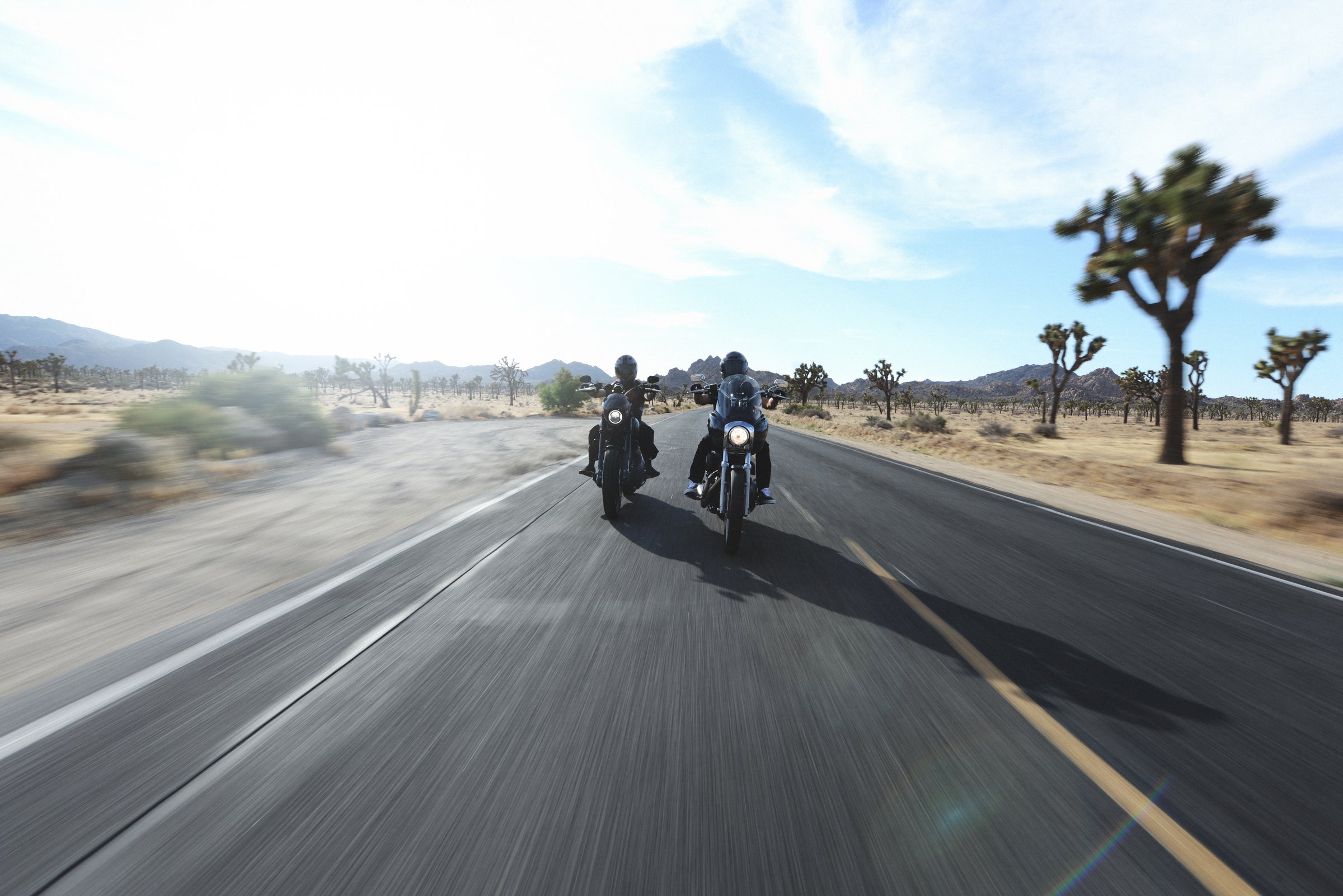 Motorcycle riders gathered at sunset